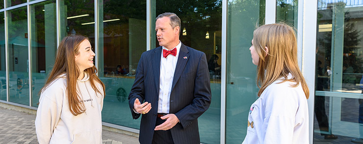 Students talking with the Dean on duty.