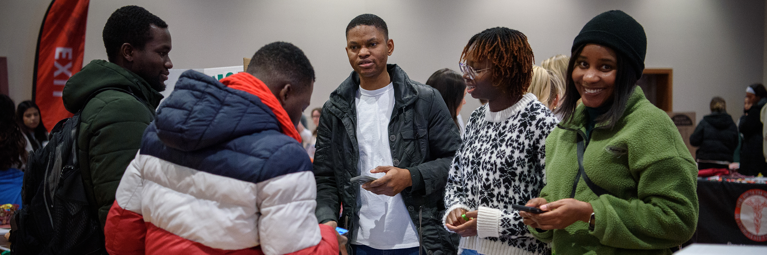 Students discussing during a fair event.